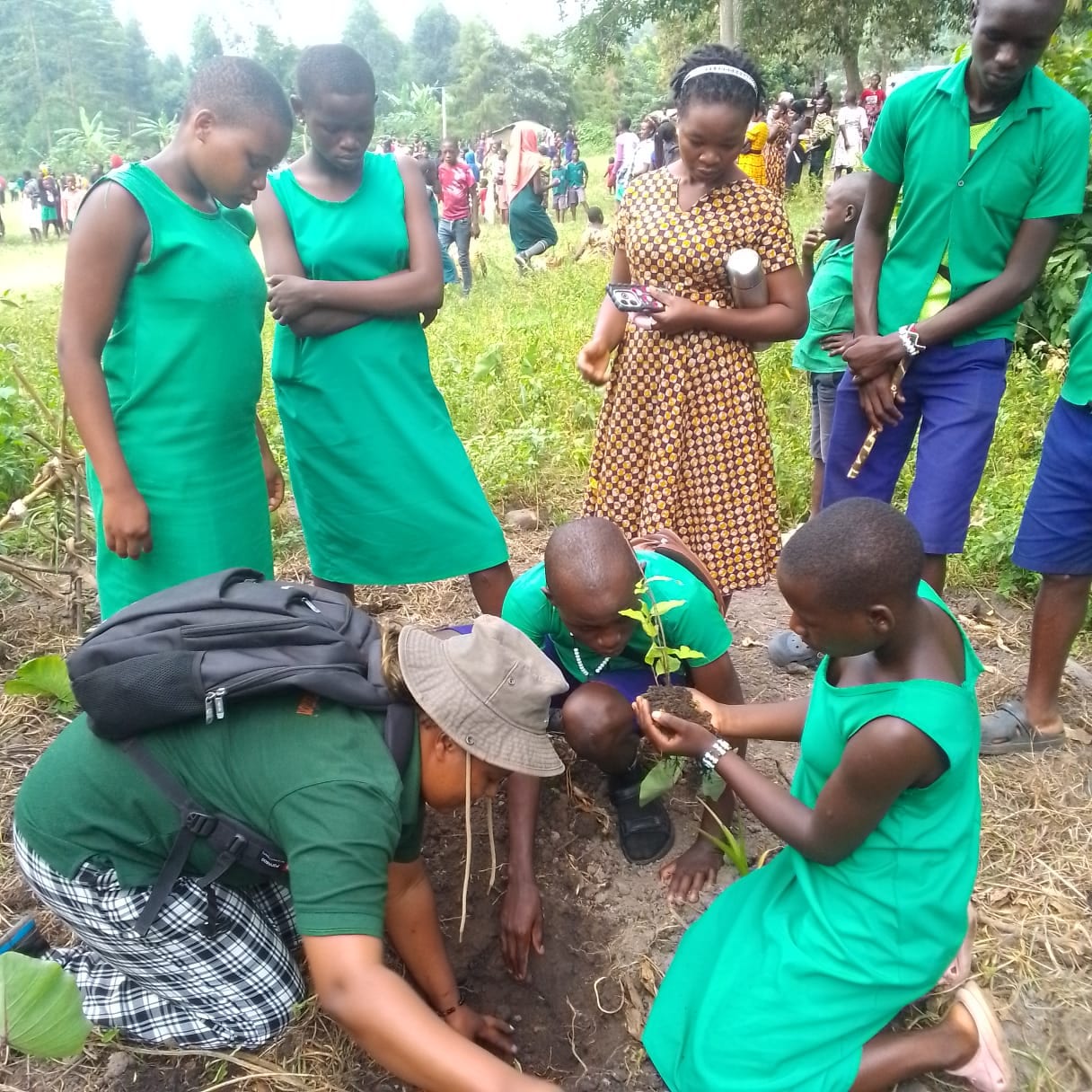 Schoolchildren planting trees for reforestation